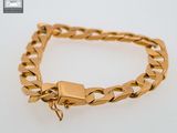 a close up of a gold bracelet with a lock on it