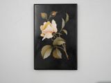 a picture of a painting of a rose on the wall
