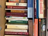 a box full of books that are sitting on the floor