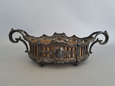 an image of a metal bowl with a decorative design on it