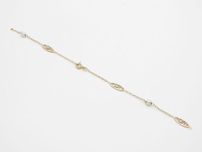 a gold chain bracelet with a white pearl bead on a white background
