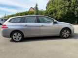 a picture of a silver car parked in a parking lot