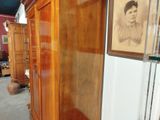 an old photo of a woman in a cabinet in a room