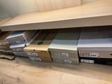 many boxes that are sitting on the floor next to each other