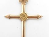 an image of a gold cross with a bird on it