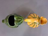 two small vases that are sitting on a table