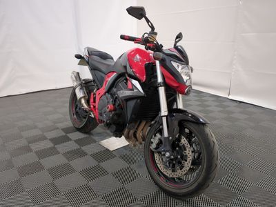 a picture of a red and black motorcycle parked on a checkered floor