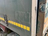 an image of a truck door with a yellow stripe on it