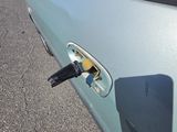 a close up of a car door handle with a key in it