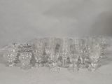 a lot of glasses that are sitting on a table
