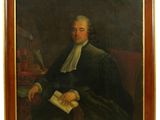 un tableau représentant un homme assis sur une chaise, tenant un livre