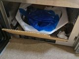 a microwave that has a blue bag inside of it