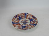 a small plate with a blue and orange design on it