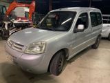 a picture of a silver van parked in a garage