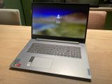 a laptop that is sitting on a wooden table