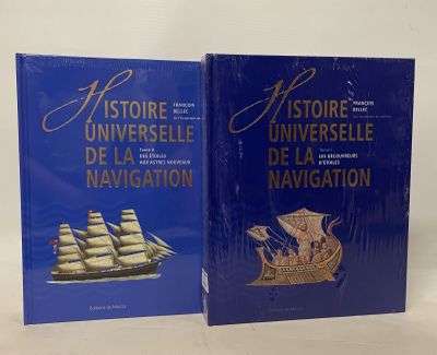 two books on a white surface with a blue cover
