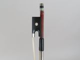 a close up of a violin bow with a string attached to it