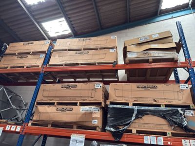 many boxes on the shelves in the warehouse