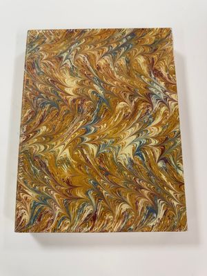 a marble block with a gold and blue swirl pattern on it