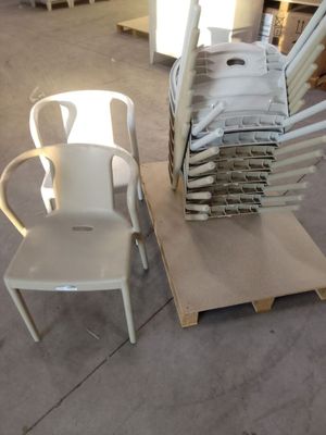 a stack of chairs and a chair on a pallet