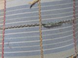 a close up of a pillow with a knot on it
