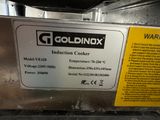 a label on a machine that says goldnax induction cooker