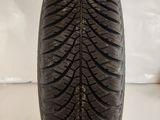 a close up of a tire on a white surface