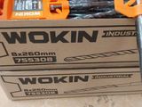 a box of tools sitting on the floor next to a pair of scissors