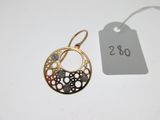 a close up of a pair of earrings with a price tag