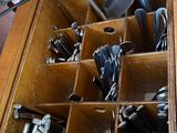 a drawer full of utensils and other kitchen utensils