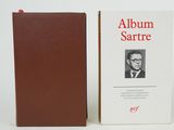 a book with a picture of a man in a suit and tie next to it