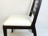 a black and white chair with a white seat
