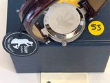 a watch that is sitting on top of a box