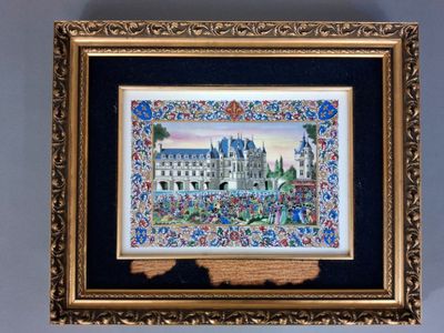 painting of a castle in a gold frame on a blue wall
