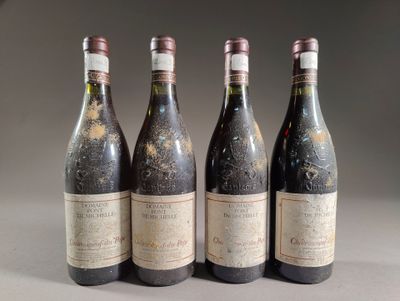 four bottles of wine are lined up on a table