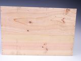 a close up of a piece of wood on a white surface
