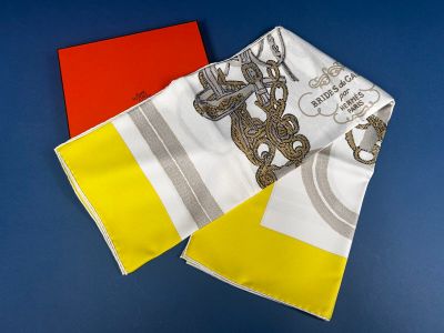 yellow, white, and red handkerchiefs on a blue surface
