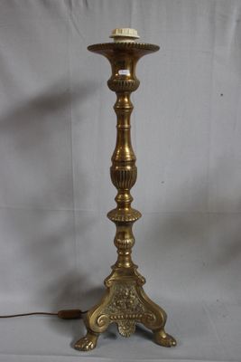 brass plated floor lamp with a candle holder on a white background