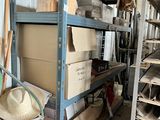 a room with a lot of boxes and a hat on the shelf