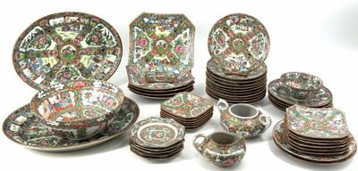 many plates and cups that are sitting on a table