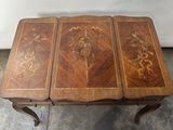 a small table with three pieces of wood on it