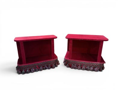 pair of red wooden boxes with tassels on them