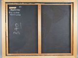 a chalkboard with a drawing of a man and a woman on it