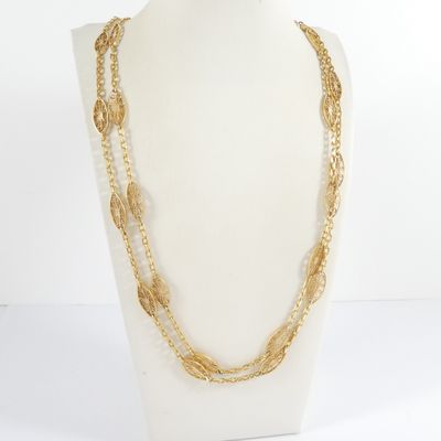 a close up of a mannequin with a necklace on it
