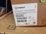a cardboard box on top of a pile of electronic equipment
