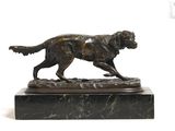 statue of a dog on a marble base on a white background