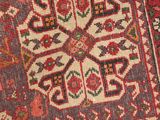 an oriental rug with a floral design on a blue ground