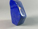 a close up of a blue stone on a white surface
