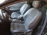 a picture of the inside of a car with leather seats