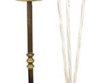 pair of antique brass candlesticks and a glass candle holder